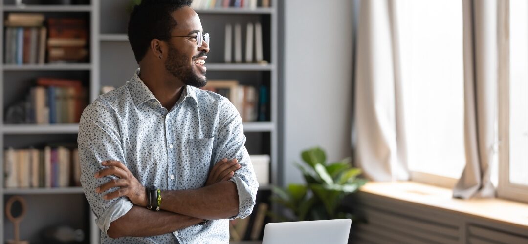 Man working at laptop in home office